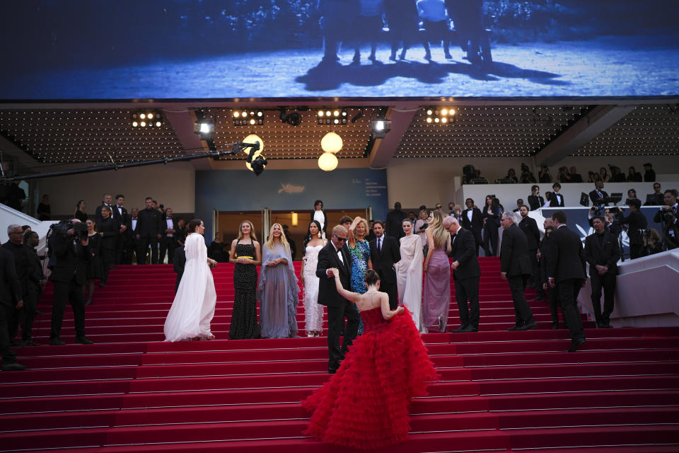 Kevin Costner, front left, and Isabelle Fuhrman, front right, pose for photographers upon arrival at the premiere of the film 'Horizon: An American Saga' at the 77th international film festival, Cannes, southern France, Sunday, May 19, 2024. (Photo by Daniel Cole/Invision/AP)