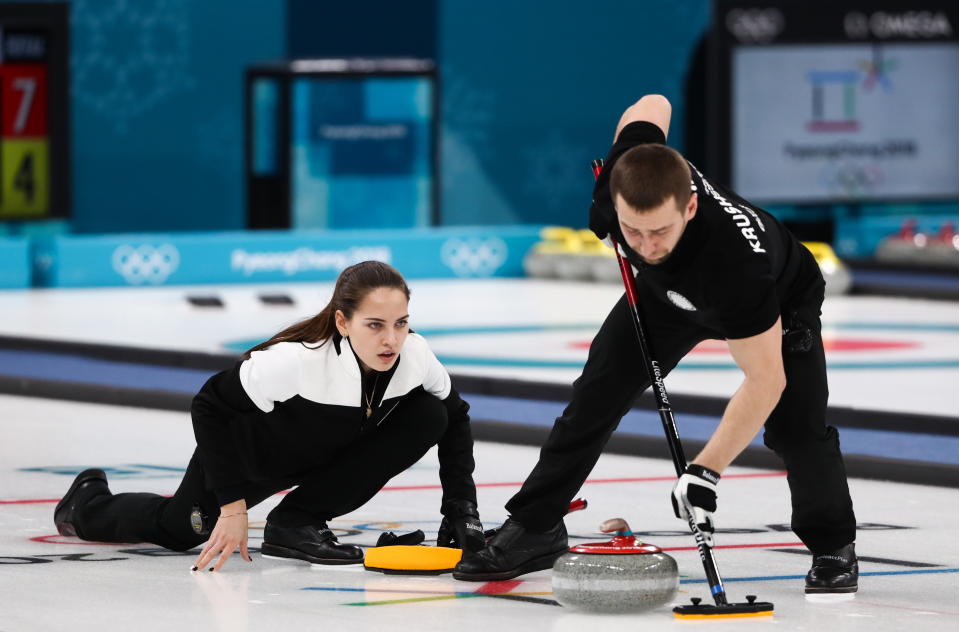 Curlers Alexander Krushelnitsky (R) and Anastasia Bryzgalova, Olympic Athletes from Russia, in their mixed doubles curling bronze medal match against Norway's Kristin Skaslien and Magnus Nedregotten during the 2018 Winter Olympic Games, at the Gangneung Curling Centre.