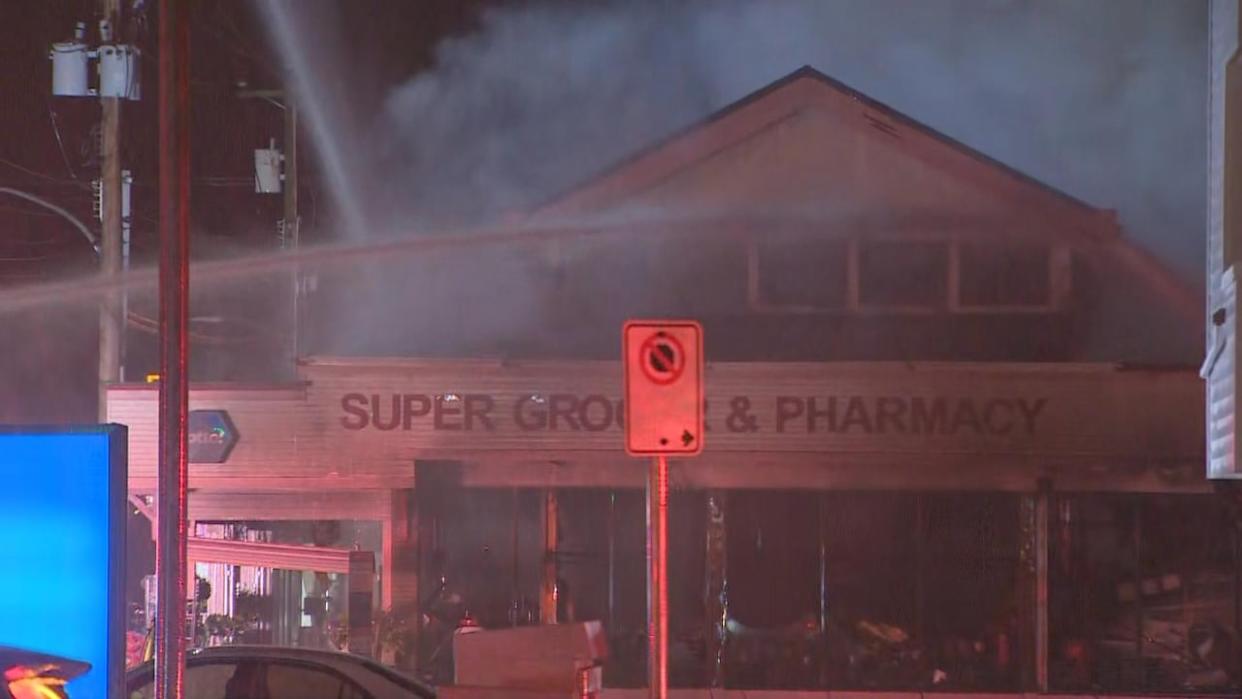 The Super Grocer on No. 1 Road in Richmond, B.C. was gutted by a Friday evening fire, with the city's mayor mourning the loss of a community institution. (Jim Mulleder/CBC - image credit)