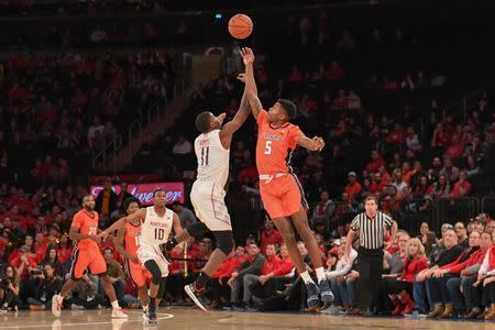 Jan 26, 2019; New York, MD, USA; Illinois Fighting Illini guard Tevian Jones (5) and Maryland Terrapins guard Darryl Morsell (11) battle for a loose ball during the second half at Madison Square Garden. Mandatory Credit: Dennis Schneidler-USA TODAY Sports