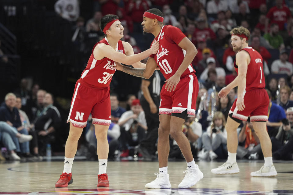 Nebraska guard Keisei Tominaga (30) celebrates with guard Jamarques Lawrence (10) after scoring during the second half of an NCAA college basketball game against Illinois in the semifinal round of the Big Ten Conference tournament, Saturday, March 16, 2024, in Minneapolis. (AP Photo/Abbie Parr)