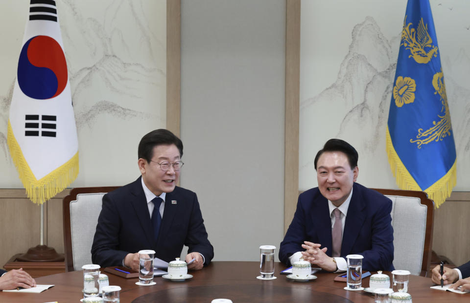 South Korean President Yoon Suk Yeol, right, talks with main opposition Democratic Party leader Lee Jae-myung during a meeting at the presidential office in Seoul South Korea, Monday, April 29, 2024. (Hong Hae-in/Yonhap via AP)