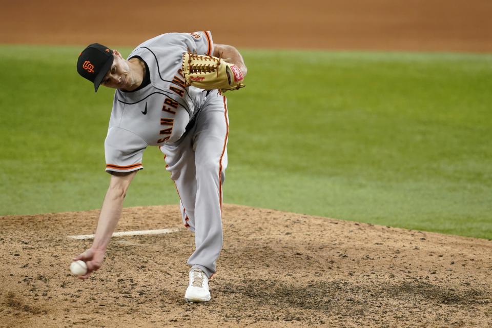 San Francisco Giants relief pitcher Tyler Rogers throws to the Texas Rangers in the ninth inning of a baseball game in Arlington, Texas, Wednesday, June 9, 2021. (AP Photo/Tony Gutierrez)