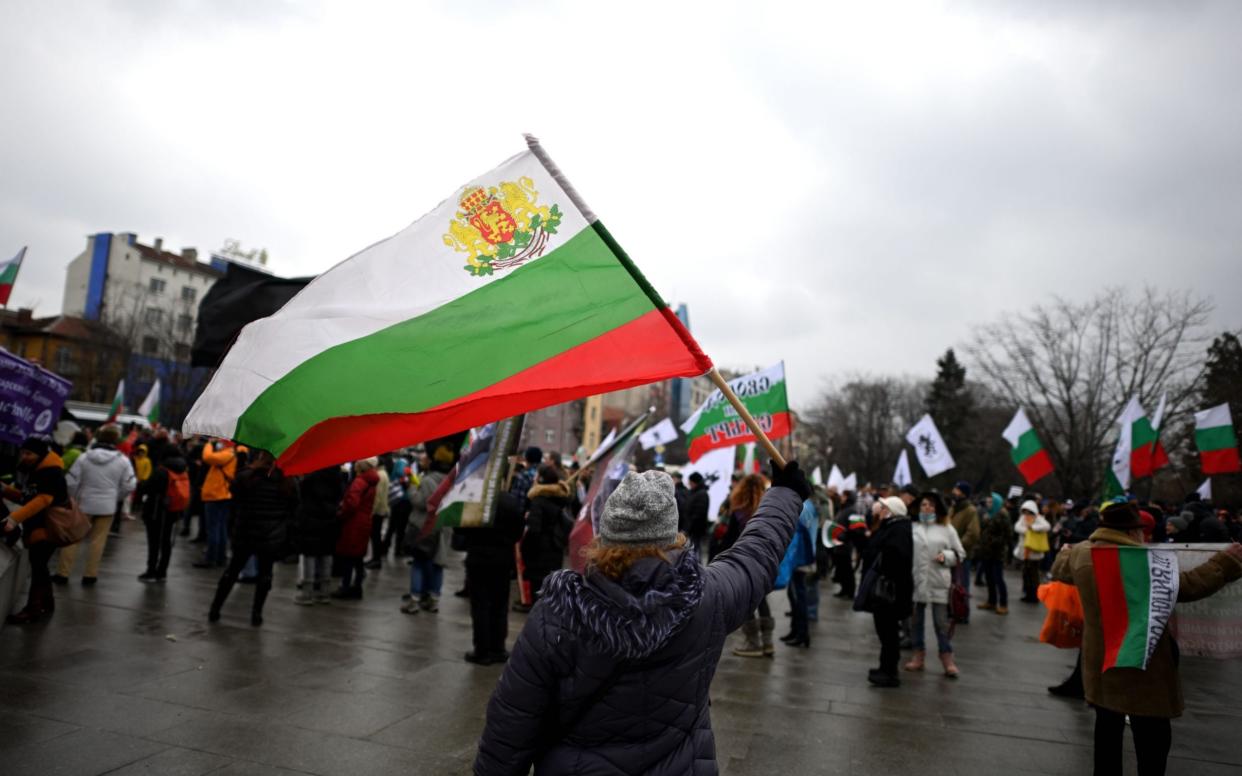 A Bulgarian waves a national flag  - Shutterstock