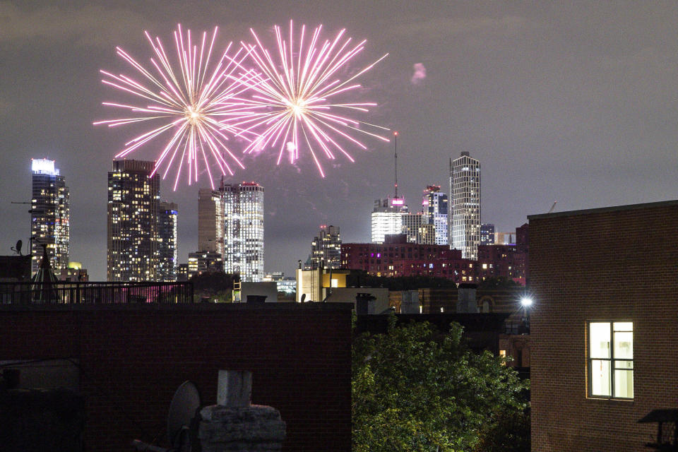 FILE - In this Friday, June 19, 2020 photo, fireworks explode during Juneteenth celebrations above the Bedford-Stuyvesant neighborhood in the Brooklyn borough of New York. The Manhattan skyline is seen in the background. They light up the sky in celebration, best known in the U.S. as a way to highlight Independence Day. This year, fireworks aren't being saved for special events. They've become a nightly nuisance from Connecticut to California, angering sleep-deprived citizens and alarming local officials. (AP Photo/John Minchillo, File)