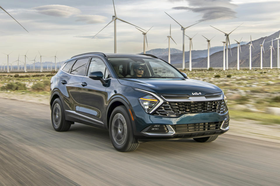 This photo provided by Kia shows the 2023 Kia Sportage, a compact SUV with a first-time hybrid variant. The Sportage is all-new for 2023 and adds more interior space and technology. (Courtesy of Kia America via AP)