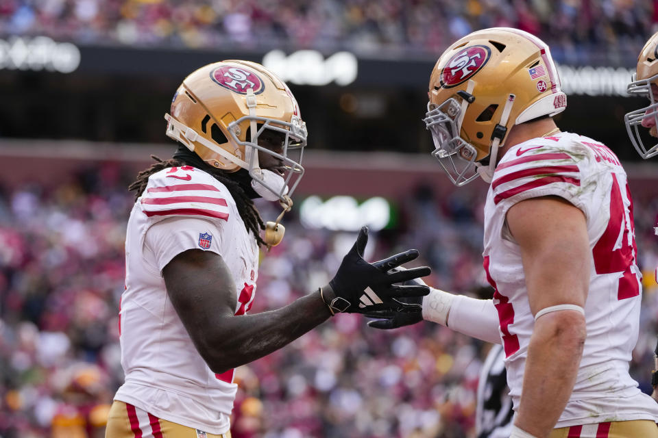 San Francisco 49ers wide receiver Brandon Aiyuk (11) celebrates his touchdown with teammate fullback Kyle Juszczyk (44) during the second half of an NFL football game against the Washington Commanders, Sunday, Dec. 31, 2023, in Landover, Md. (AP Photo/Alex Brandon)