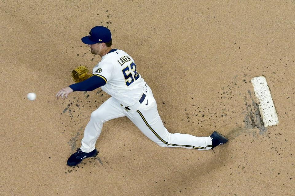 Milwaukee Brewers starter Eric Lauer throws during the first inning of a baseball game against the Los Angeles Dodgers Thursday, April 29, 2021, in Milwaukee. (AP Photo/Morry Gash)