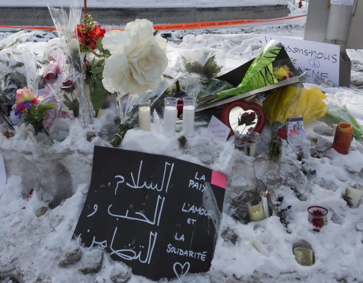 A makeshift memorial is set up near the Quebec City mosque where six people died as a result of an attack during evening prayers. Photo from The Canadian Press. 