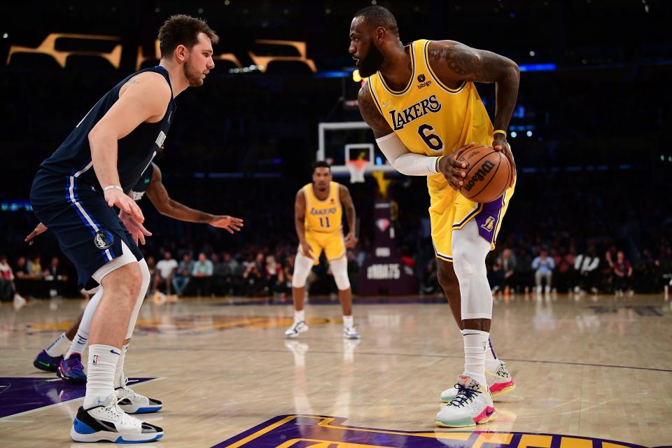 LeBron James, right, and the Los Angles Lakers will face Luka Doncic and the Mavericks in Dallas on Christmas Day.