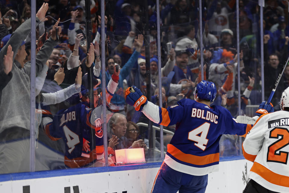 New York Islanders defenseman Samuel Bolduc (4) reacts after scoring a goal against the Philadelphia Flyers in the second period of an NHL hockey game Saturday, April 8, 2023, in Elmont, N.Y. (AP Photo/Adam Hunger)