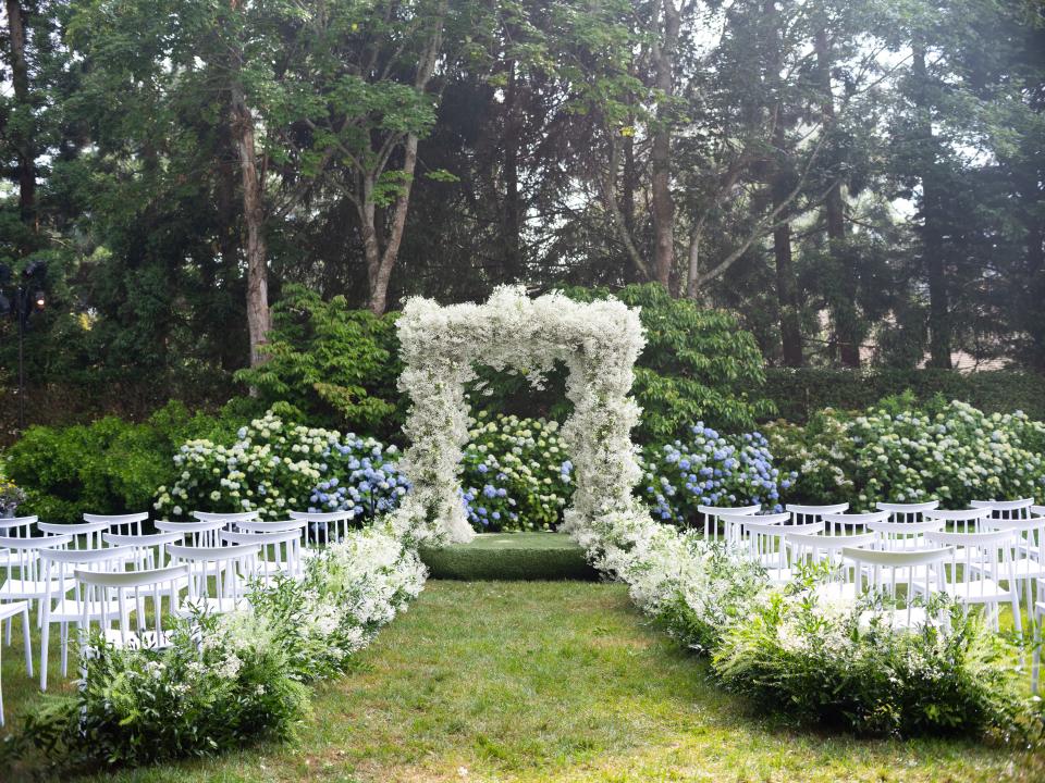 The Bride and Groom Said Their Vows Beneath a Floral Chuppah at This Hamptons Backyard Wedding