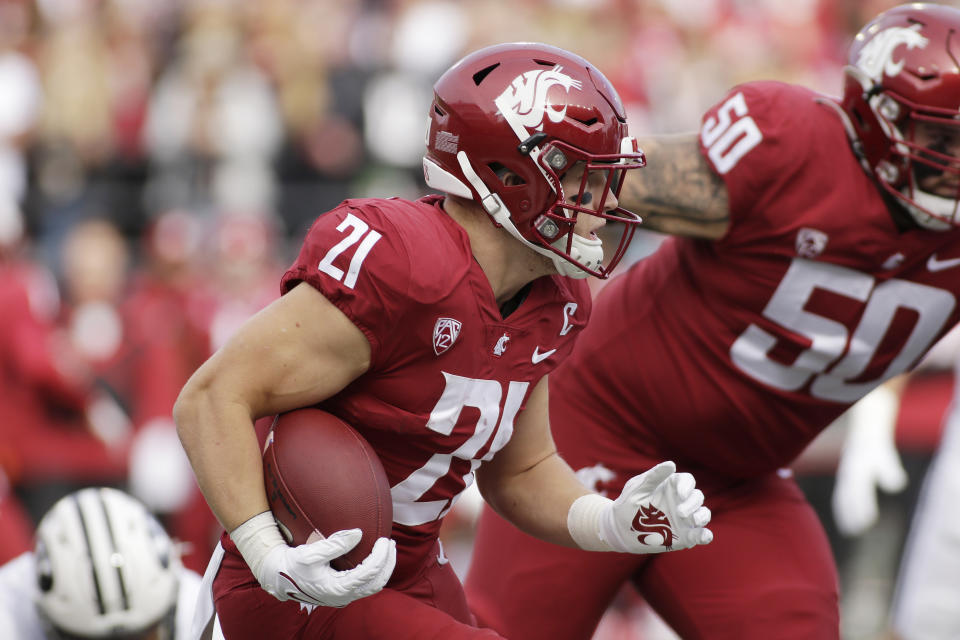 Washington State running back Max Borghi (21) carries the ball during the first half of an NCAA college football game against BYU, Saturday, Oct. 23, 2021, in Pullman, Wash. (AP Photo/Young Kwak)