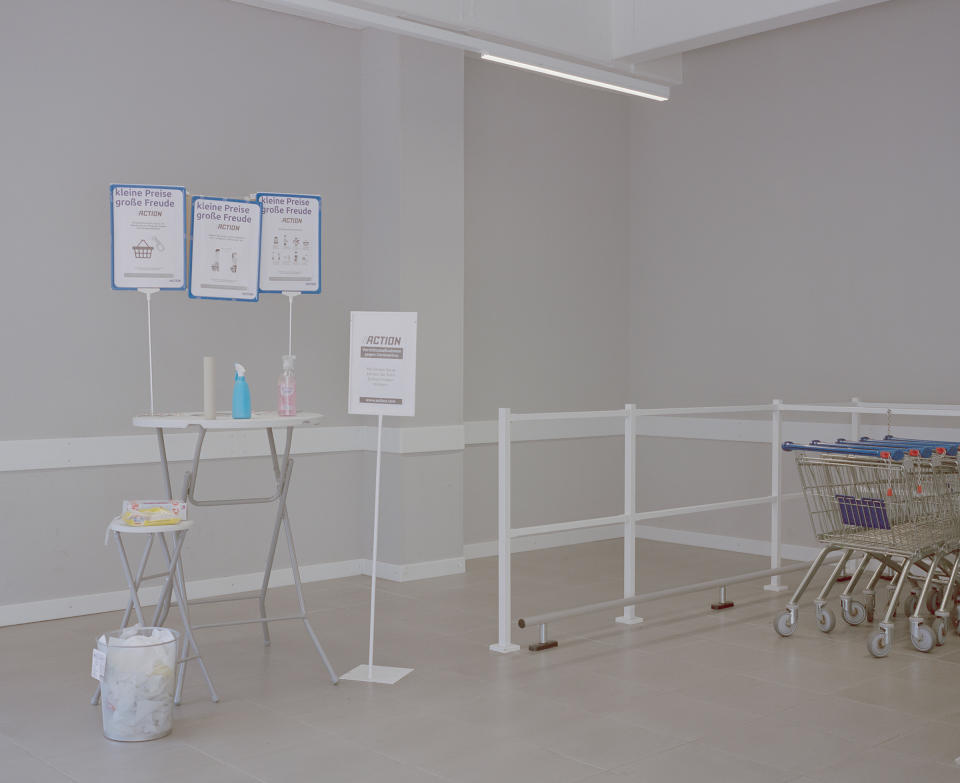 The entrance area of a store in Minden, Germany, April 9. German supermarkets have taken safety measures that include placing cashiers behind perspex windows and designating an employee to disinfect shopping baskets and carts at the entrance. | Ingmar Björn Nolting—DOCKS Collective