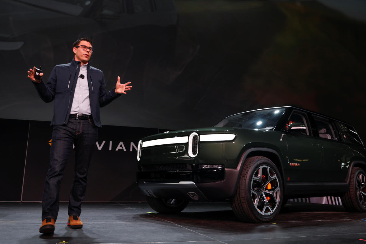 R.J. Scaringe, Rivian's 35-year-old CEO, introduces his company's all-electric R1S SUV at the Los Angeles Auto Show in Los Angeles, California, U.S. November 27, 2018.  REUTERS/Mike Blake