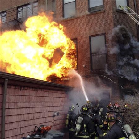 Firefighters battle a nine-alarm blaze in Boston's Back Bay neighborhood March 26, 2014. REUTERS/Boston Fire Department