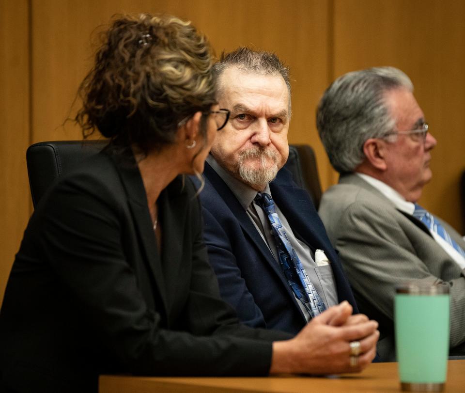 David Marshall Murdock sits at the defense table in Bartow with attorneys Debra Tuomey, left, and Daniel Hernandez after a jury found him guilty Wednesday of first-degree murder for the shooting death of ex-girlfriend Lisa Lorraine Bunce. He was also convicted of second-degree attempted murder for shooting Sanda Andrews.