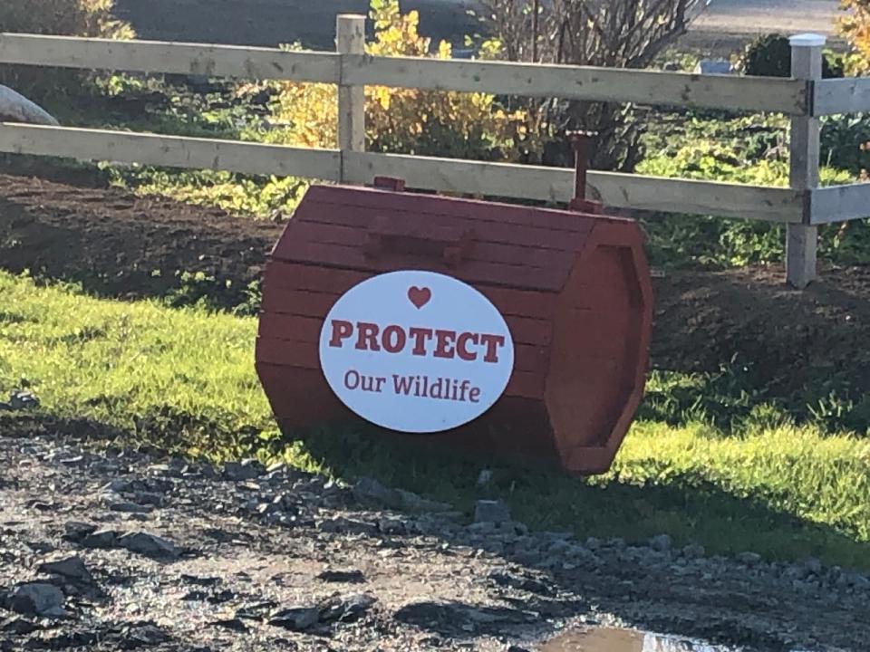 Red and white signs plastered on dozens of garbage boxes in some communities on the Port au Port Peninsula. 