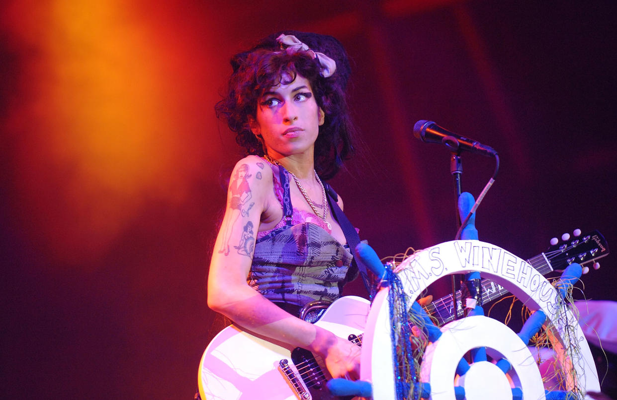 NEWPORT, UNITED KINGDOM - SEPTEMBER 06:  Amy Winehouse headlines the main stage on day 2 of Bestival on the Isle of Wight, England.  (Photo by Samir Hussein/Getty Images)