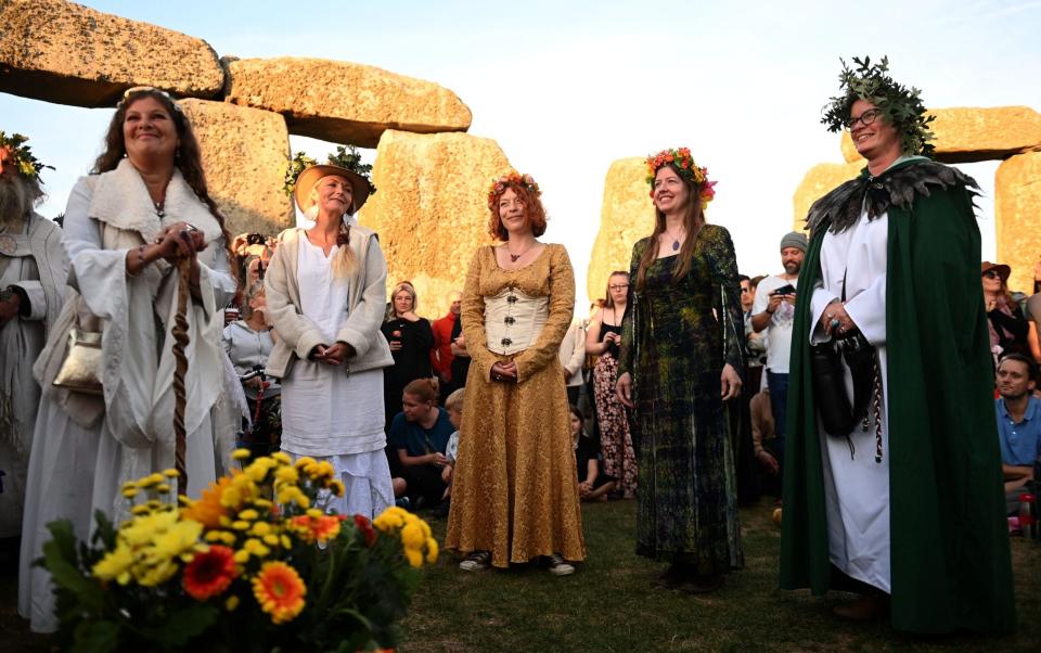 Druids perform a ceremony during summer solstice celebrations at the ancient Stonehenge monument - NEIL HALL/EPA-EFE/Shutterstock