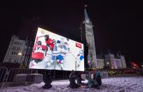 <p>A giant video screen on Parliament Hill’s west lawn streams the NHL 100 Classic at nearby Landsdowne Park in Ottawa on Saturday. </p>