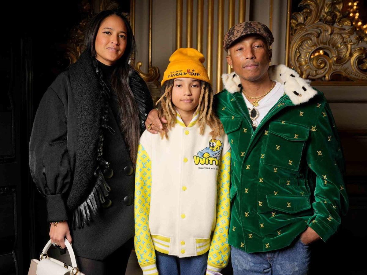 Pharrell Williams and Helen Lasichanh arriving to the Chanel show