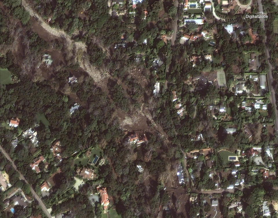 <p>This Jan. 11, 2018 satellite image released by DigitalGlobe News Bureau shows an area of homes after storms caused mudslides and flooding in Montecito, Calif. (Photo: DigitalGlobe News Bureau via AP) </p>
