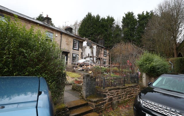 The scene in Ramsbottom, Bury, Greater Manchester, where the body of a woman has been found after a house collapsed on Wednesday evening 