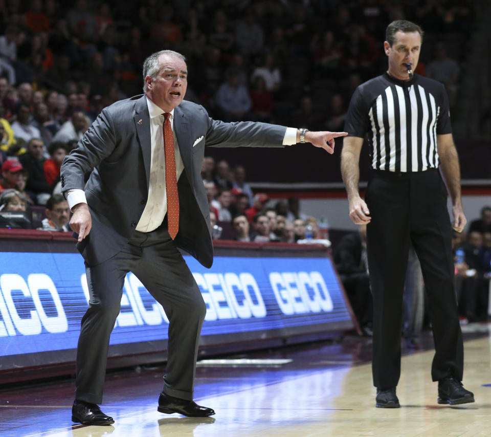 Virginia Tech head coach Mike Young instructs his players from the bench in the first half of an NCAA college basketball game against North Carolina State, Saturday, Jan. 11, 2020, in Blacksburg, Va. (Matt Gentry/The Roanoke Times via AP)