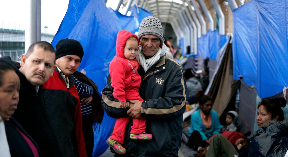 Families hoping to seek asylum in the United States wait on the bridge connecting Reynosa, Mexico, to Hidalgo, Texas, on March 15, 2019.