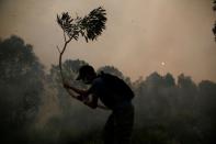 The Wider Image: Indonesia's firefighters on frontline of Borneo's forest blazes