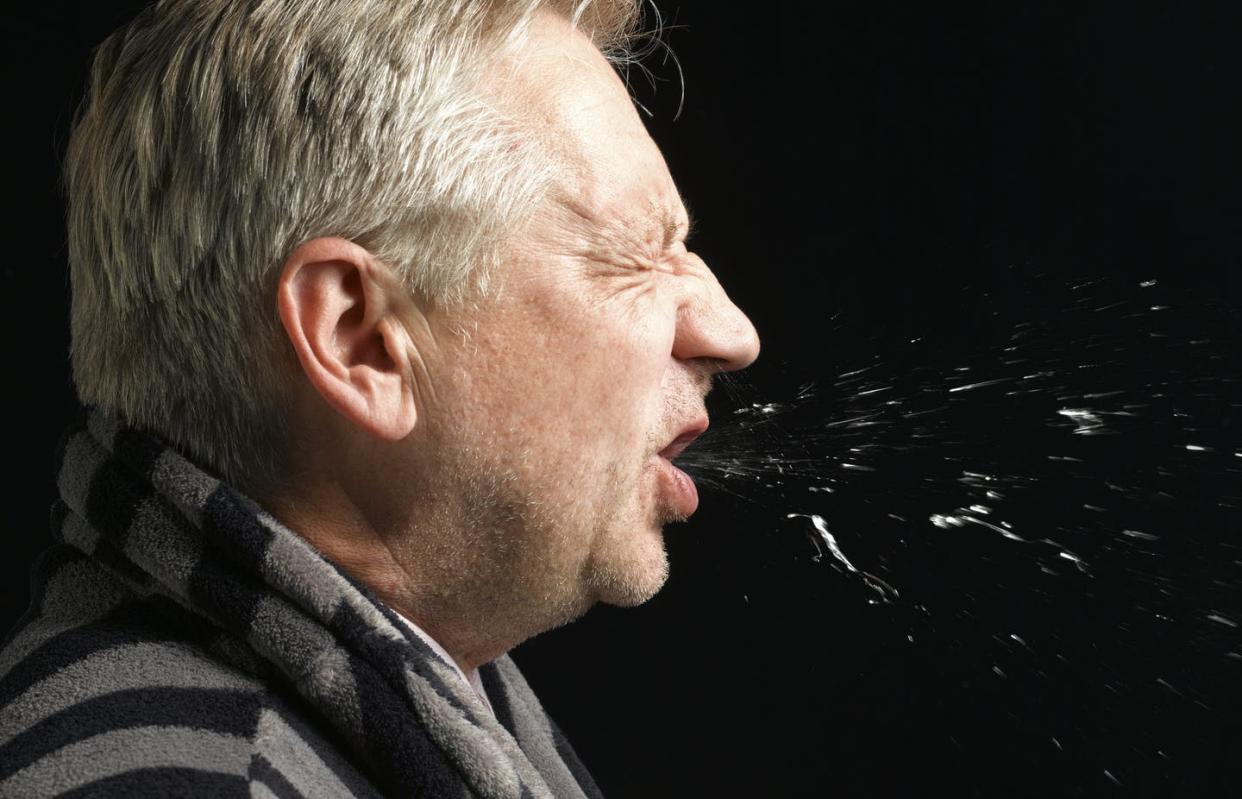 <span class="caption">From your lungs into the air around you, aerosols carry coronavirus.</span> <span class="attribution"><a class="link " href="https://www.gettyimages.com/detail/photo/man-with-flu-coughing-and-sneezing-royalty-free-image/148981627?adppopup=true" rel="nofollow noopener" target="_blank" data-ylk="slk:Peter Dazeley/The Image Bank via Getty Images;elm:context_link;itc:0;sec:content-canvas"> Peter Dazeley/The Image Bank via Getty Images</a></span>