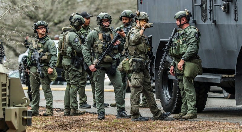 DeKalb, Ga., and Atlanta SWAT members are pictured leaving the Gresham Park command post in Atlanta on Wednesday, Jan. 18, 2023. Georgia state troopers helping conduct a “clearing operation” at the site of Atlanta’s planned public safety training center exchanged gunfire with a protester Wednesday morning, leaving the protester dead and one trooper wounded, according to the Georgia Bureau of Investigation. 