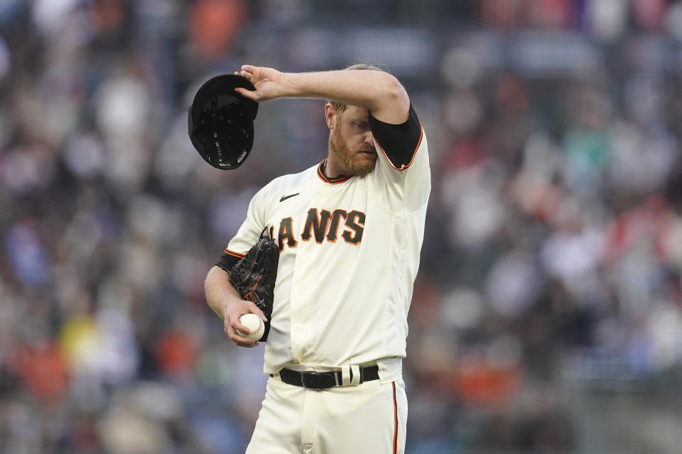 San Francisco Giants pitcher Alex Cobb reacts after walking Arizona Diamondbacks' Buddy Kennedy during the third inning of a baseball game in San Francisco, Monday, July 11, 2022. (AP Photo/Jeff Chiu)