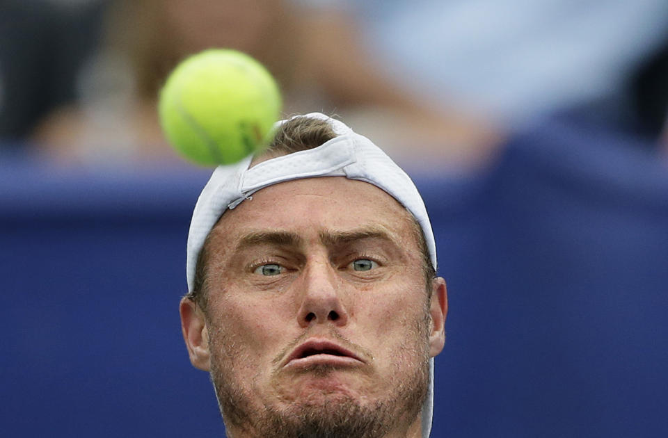 <p>Lleyton Hewitt, of Australia, returns a shot during a semifinal match against John Isner at the Atlanta Open tennis tournament, July 27, 2013, in Atlanta. (AP Photo/David Goldman) </p>