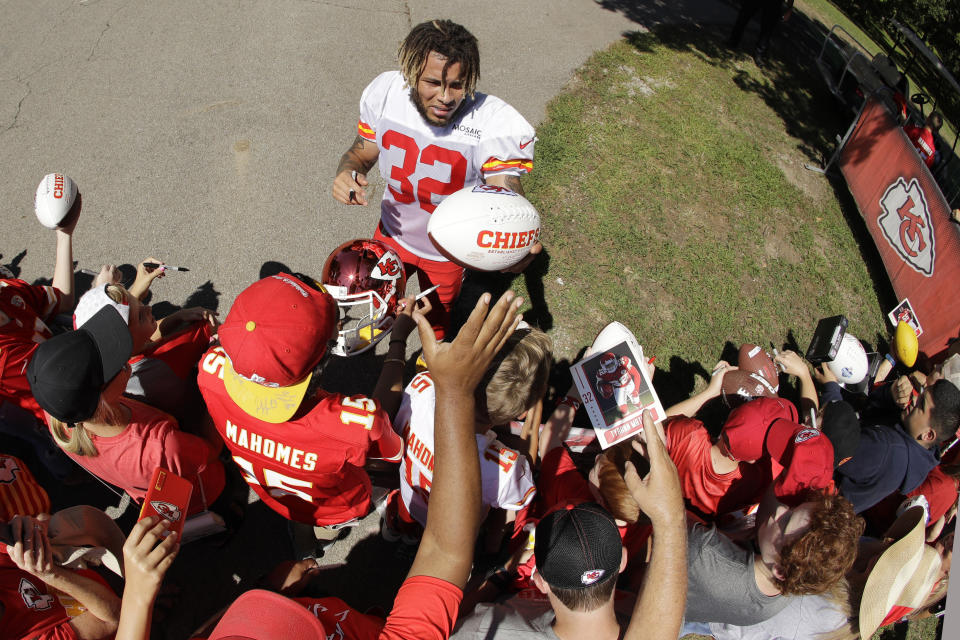 Kansas City Chiefs free safety Tyrann Mathieu signs autographs after NFL football training camp Monday, July 29, 2019, in St. Joseph, Mo. (AP Photo/Charlie Riedel)