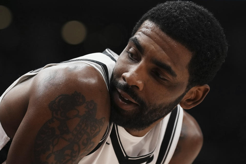 Brooklyn Nets' Kyrie Irving reacts during the second half of the team's NBA basketball game against the Toronto Raptors on Wednesday, Nov. 23, 2022, in Toronto. (Chris Young/The Canadian Press via AP)