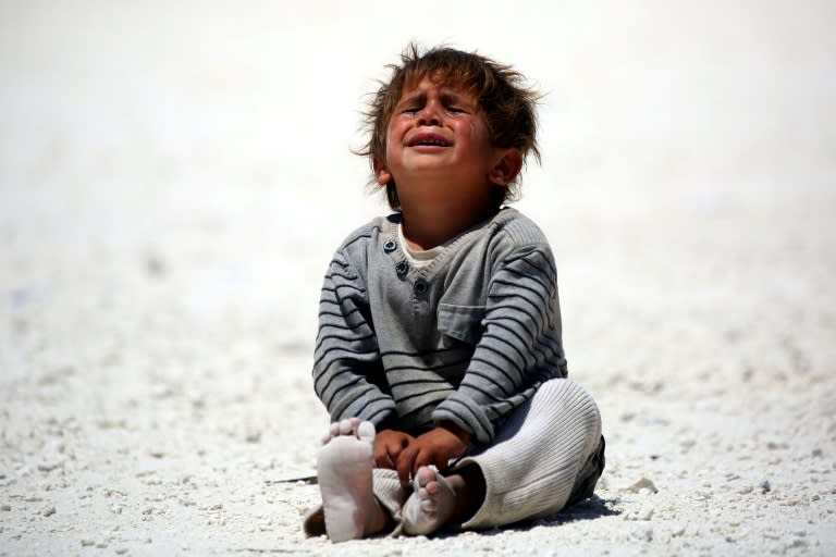 A displaced Syrian child at a temporary camp in the northern Syrian village of Ain Issa on June 10, 2017, where many people who have fled Raqa are taking shelter