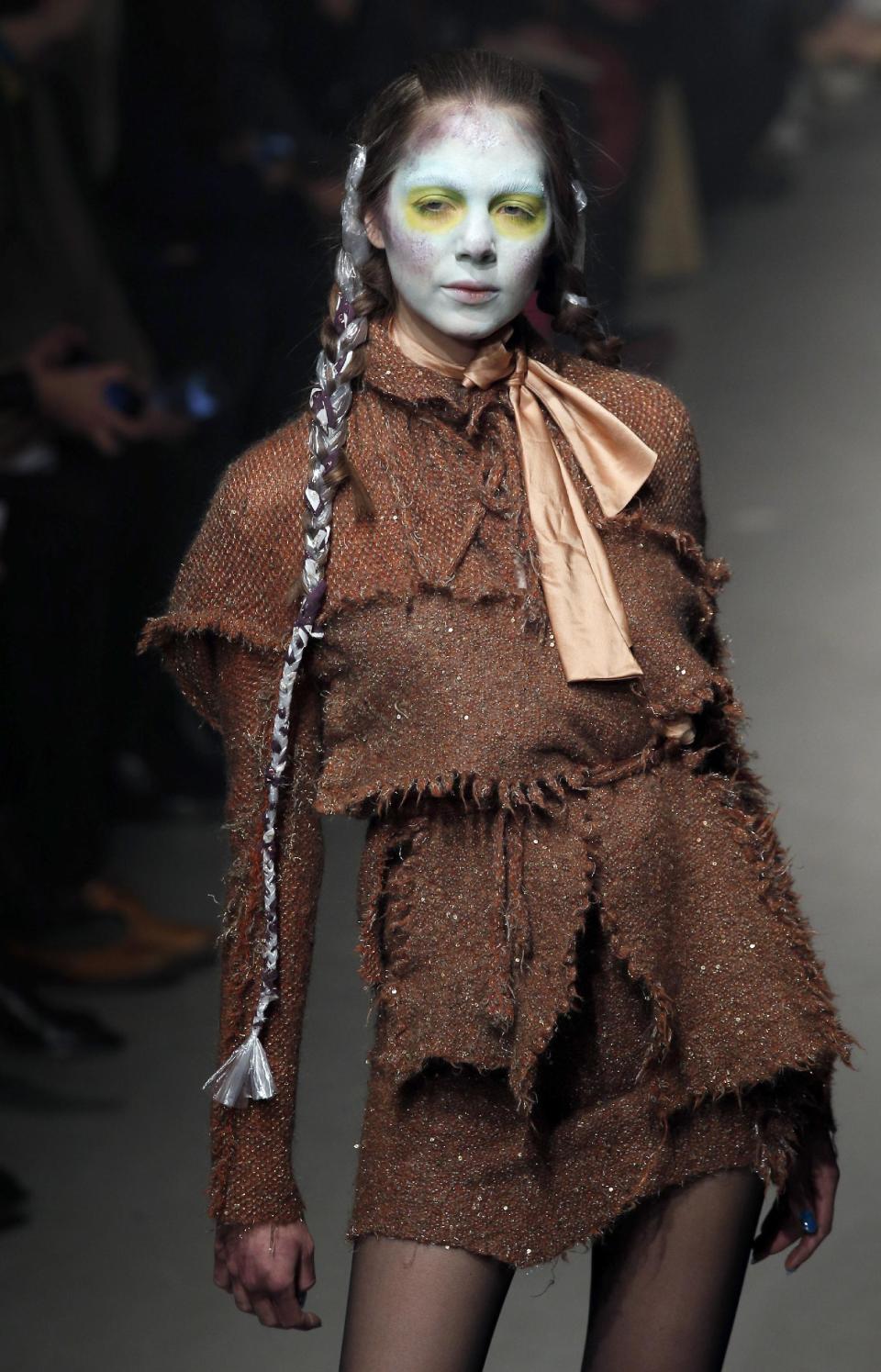A model wears a creation by designer Vivienne Westwood for her Fall/Winter 2013-2014 ready to wear collection, in Paris, Saturday, March 2, 2013. (AP Photo/Christophe Ena)