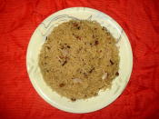 <p>Jaggery and rice are the main ingredients of this dish combined with cardamoms, cloves, bay leaves and raisins. The dish is fairly simple to make. Bring the water to a boil and add some rice, cloves and cardamoms. Allow the rice to cook. Drain the rice once cooked in a colander. Put a heavy bottomed pan on flame. Add ghee, cardamoms, cloves, bay leaves, rice and mix well. Lower the heat and mix in the jaggery. Stir for a couple of minutes till cooked. Sprinkle some raisins on top. “Creative Commons Gur Kay Chawal” by Miansari66 is licensed under CC BY 1.0 </p>