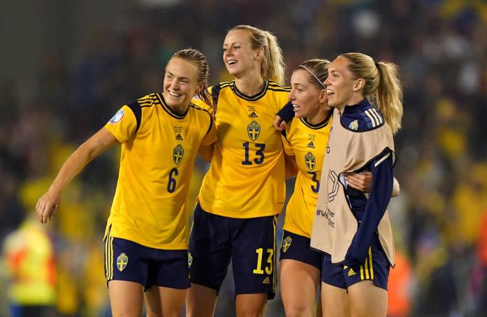 Magdalena Eriksson, left, celebrates with team-mates at full-time, including match-winner Linda Sembrant, second right (Tim Goode/PA) (PA Wire)