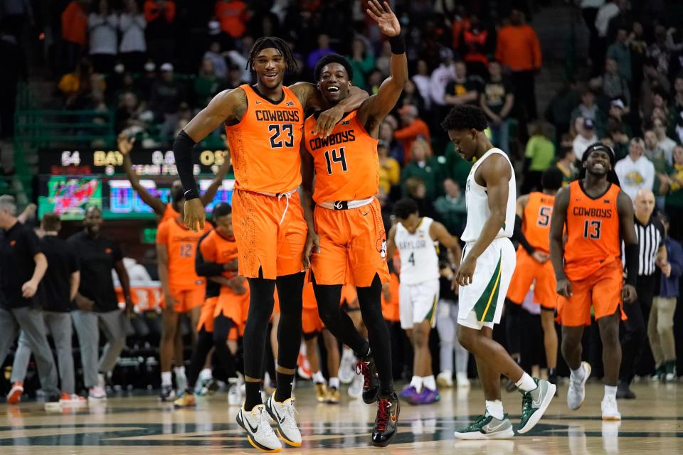 Oklahoma State guard Bryce Williams celebrates with forward Tyreek Smith (23) following the Cowboys&#39 victory over Baylor at Ferrell Center.