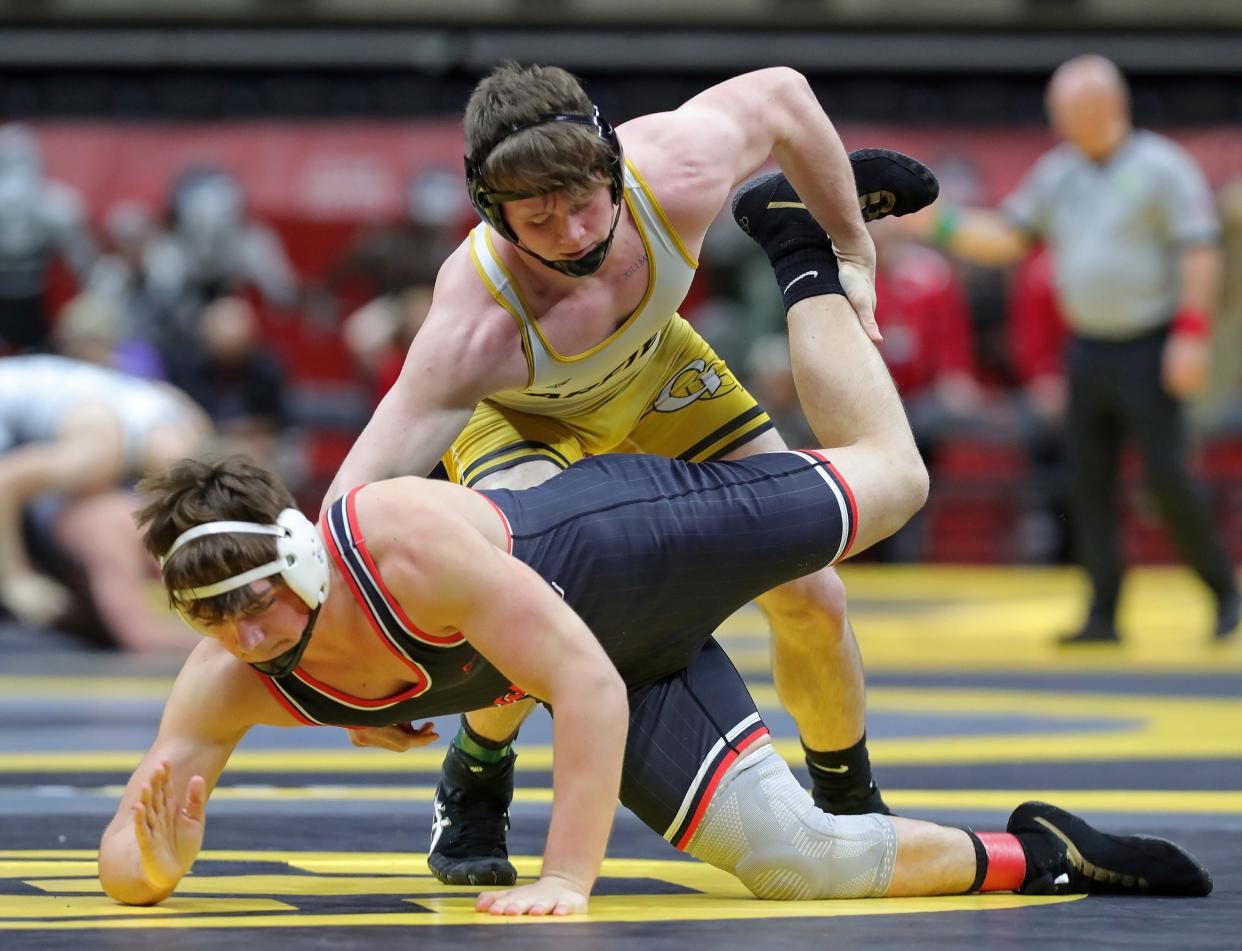 Keegan Sell of Garrettsville Garfield, top, takes down Landon O'Donnell of Marion Pleasant during their 190 pound Division III match in the preliminary round of the 2024 OHSAA State Wrestling Tournament at the Schottenstein Center, Friday, March 8, 2024, in Columbus, Ohio.