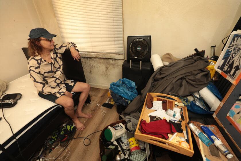 Los Angeles, CA - May 16: Cecil Hotel on Tuesday, May 16, 2023 in Los Angeles, CA. Rigo Veloso, 51, views mold on the wall of his room at the Cecil Hotel located at 640 S Main St, Los Angeles where tenants complain of difficult living conditions. The Cecil Hotel was built as a budget hotel in 1924 and in 2021 was reopened as an affordable housing complex operated by the Skid Row Housing Trust. The facility plans to provide affordable living accommodations for 600 low-income residents. In February 2017, the Los Angeles City Council voted to deem the Cecil a Historic-Cultural Monument, because it is representative of an early 20th-century American hotel and because of the historic significance of its architect's body of work. (Al Seib / For The Times)