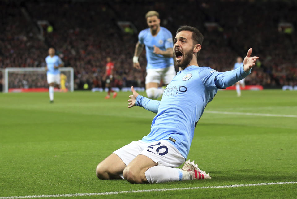 Manchester City's Bernardo Silva celebrates after scoring the opening goal during the English Premier League soccer match between Manchester United and Manchester City at Old Trafford Stadium in Manchester, England, Wednesday April 24, 2019. (AP Photo/Jon Super)