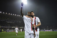 AC Milan's Rafael Leao, left, celebrates with AC Milan's Olivier Giroud after scoring their side's second goal of the game during the Serie A soccer match between Fiorentina and AC Milan at the Artemio Franchi Stadium in Florence, Italy, Saturday March 30, 2024. (Massimo Paolone/LaPresse via AP)