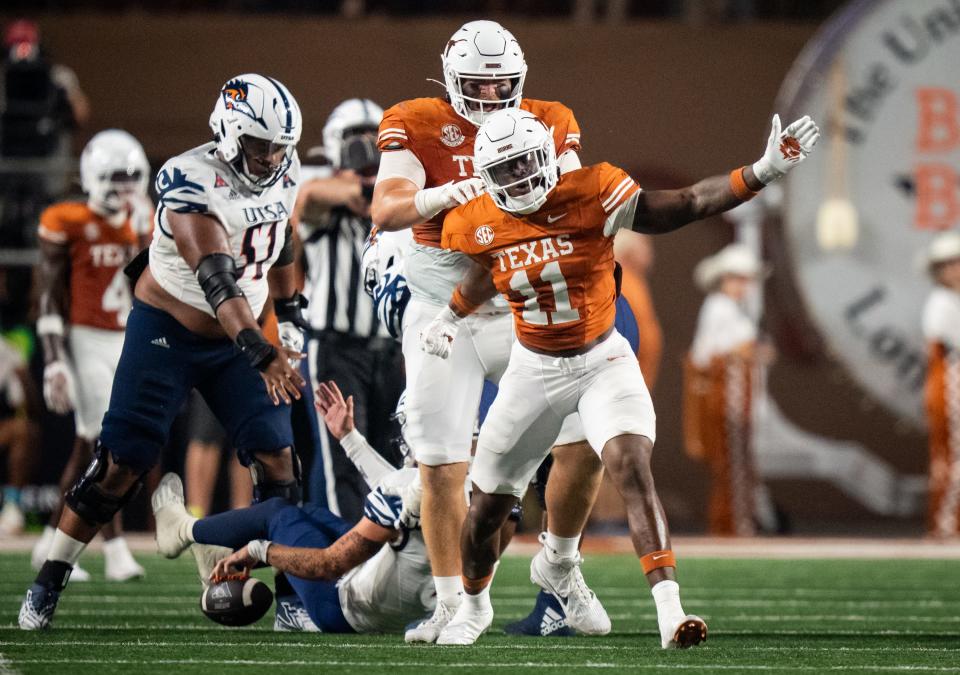 Texas edge rusher Colin Simmons, a freshman from Duncanville, celebrates a third-quarter sack against UTSA on Sept. 14. He leads the team with four sacks through the first five games.