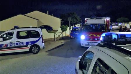 Still image taken from video shows Police vehicles at the scene near where a French police commander was stabbed to death in front of his home in the Paris suburb of Magnanville, France, June 14, 2016. REUTERS/Reuters TV