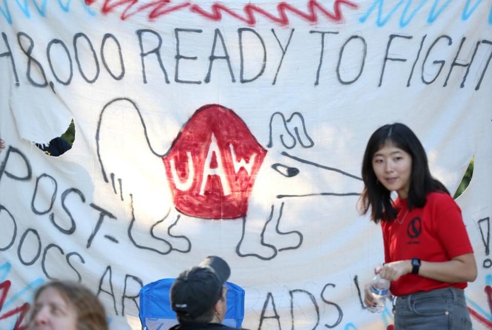 A banner displaying support for the the protesting UC unionized academic workers is displayed at UC Irvine on Monday.