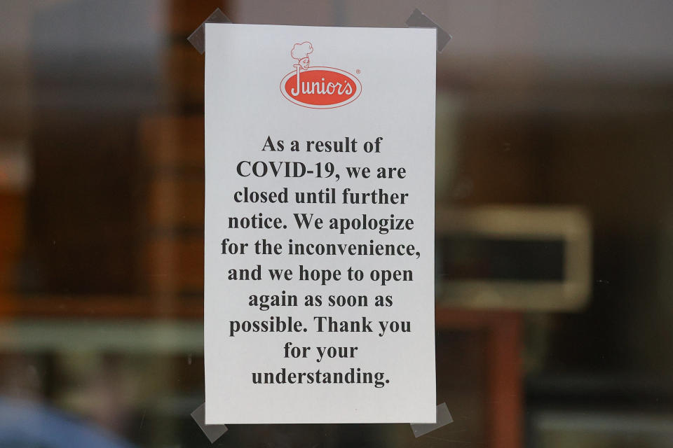 NEW York, NY - MARCH 18:  A general view of a sign inside the window of Juniors Cheesecake that because of COVID-19 they are closed until further notice on March 18, 2020 in New York, NY.   (Photo by Rich Graessle/Icon Sportswire via Getty Images)
